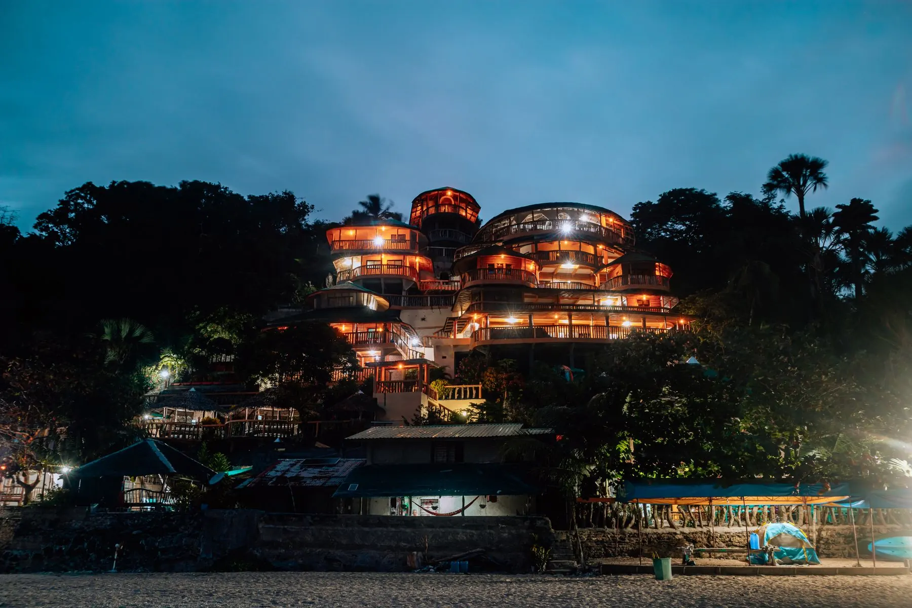 Hillside resort illuminated at night